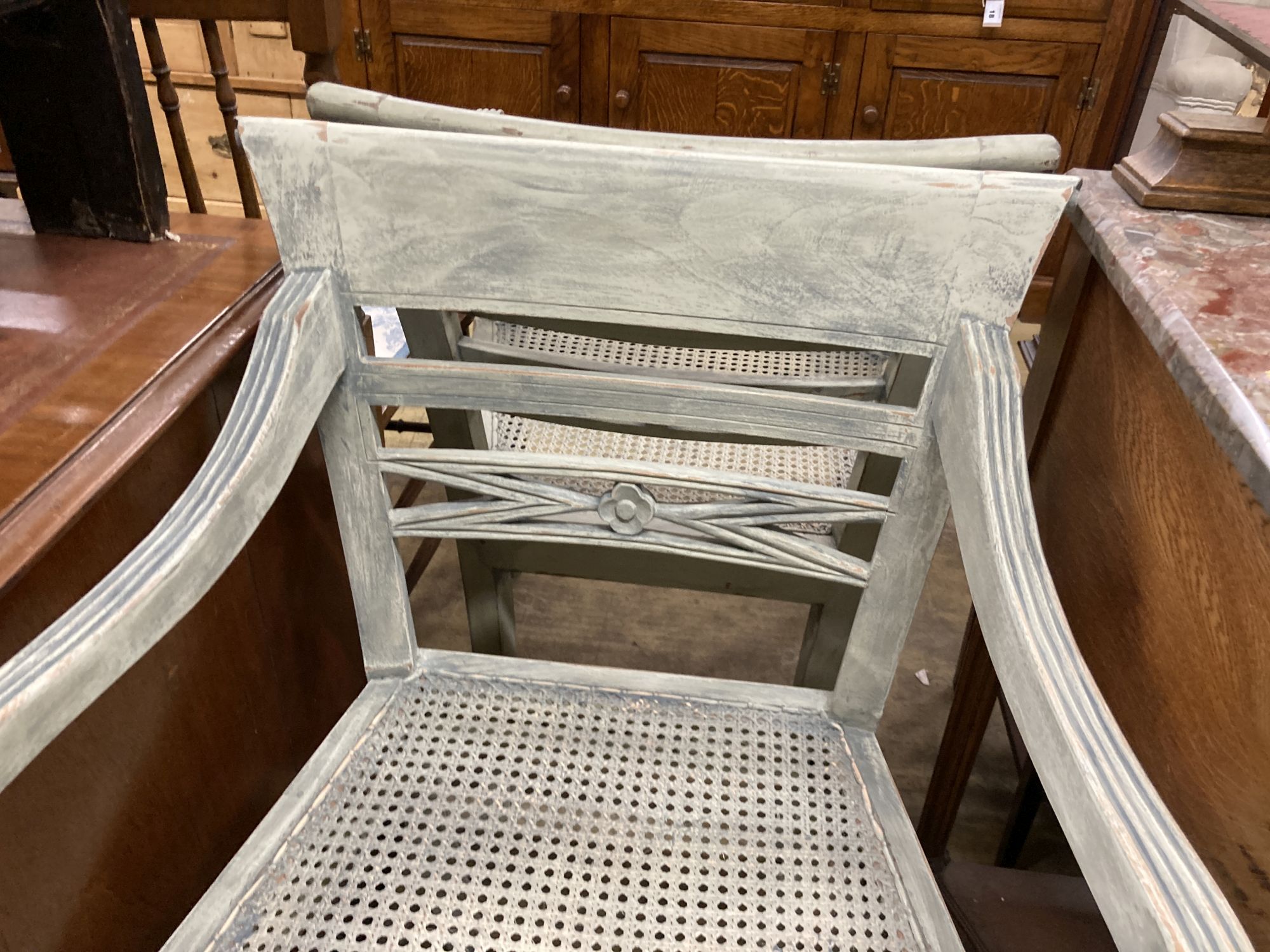 A pair of Dutch colonial style painted cane seat dining chairs, width 55cm, depth 50cm, height 86cm